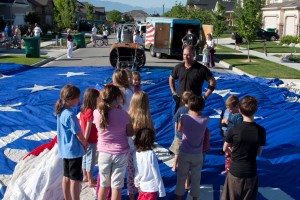 Tim talking to the kids in his superman pose Tim talking to the kids in his superman pose
